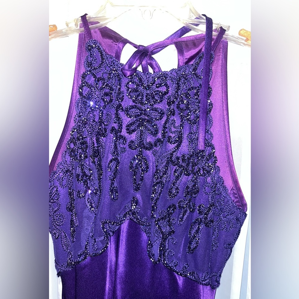 Beautiful, holiday or formal dress. Halter style with beaded top and open back.